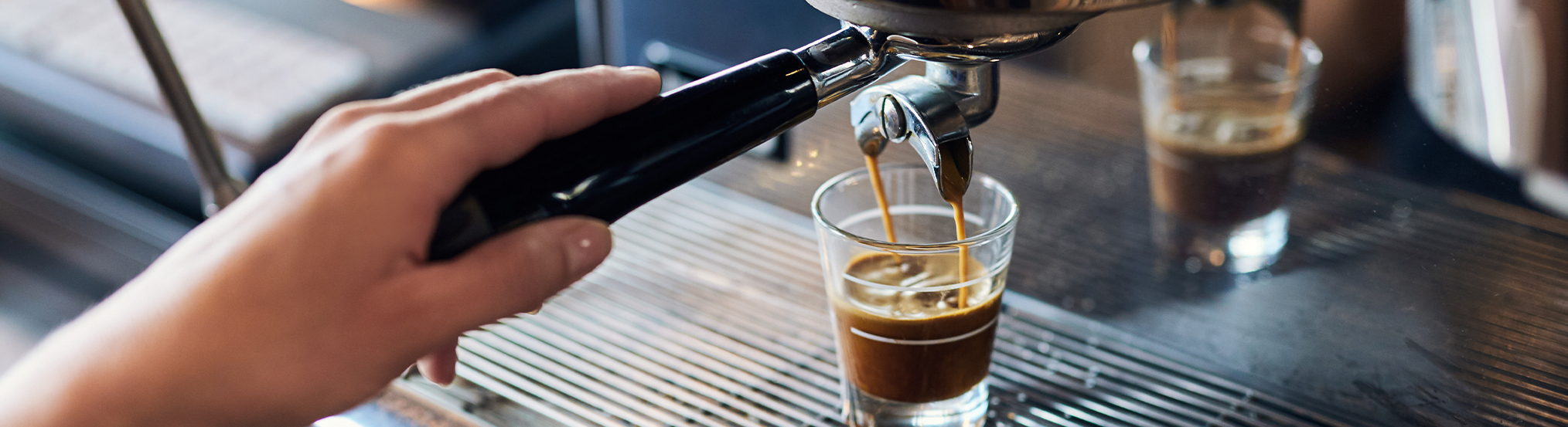 expresso pouring into a cup