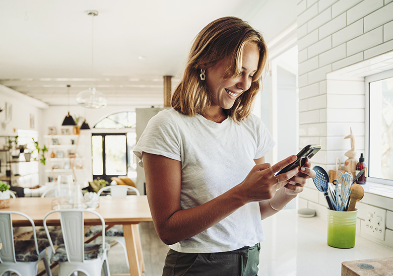 women with phone in the kitchen