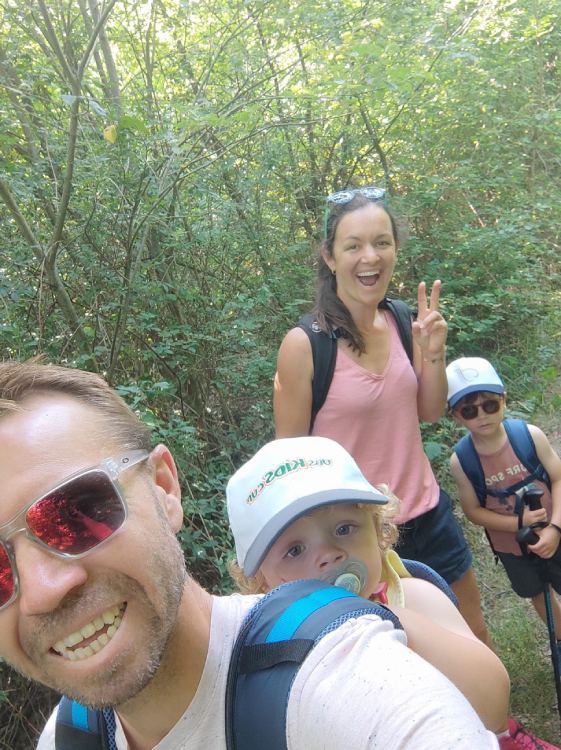 family smiling at camera