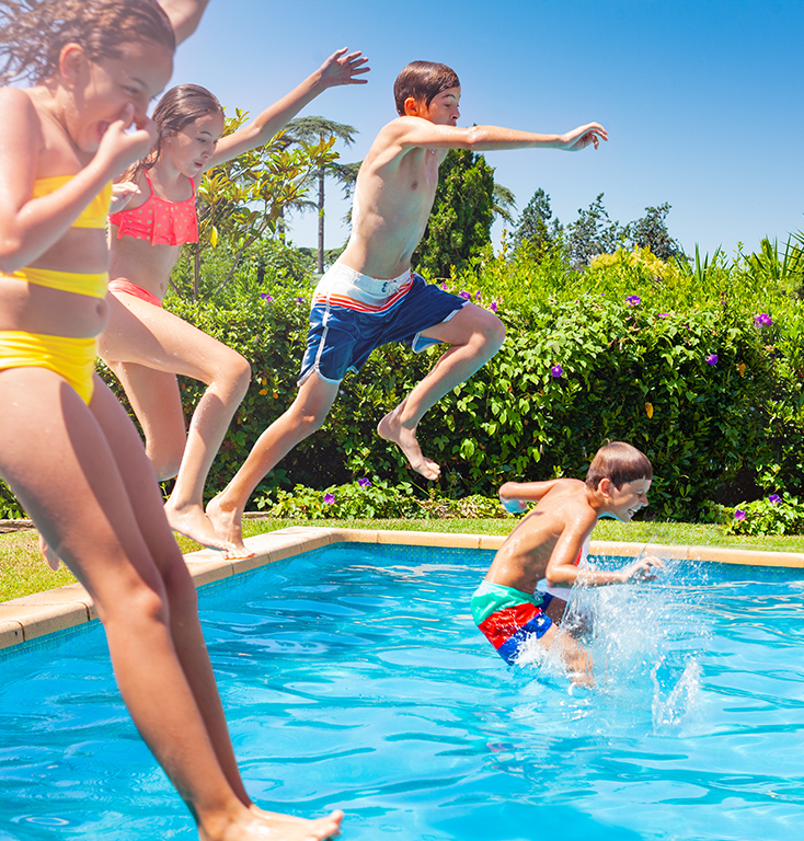 kids jumping in a pool