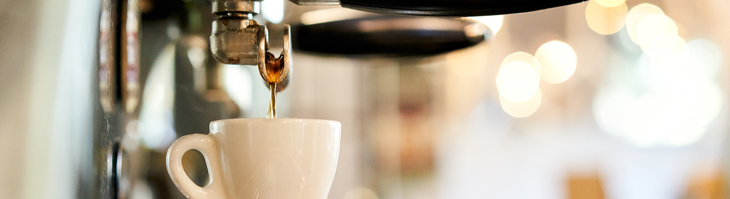 coffee dripping into a cup