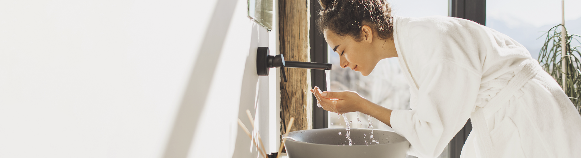 woman washing her face